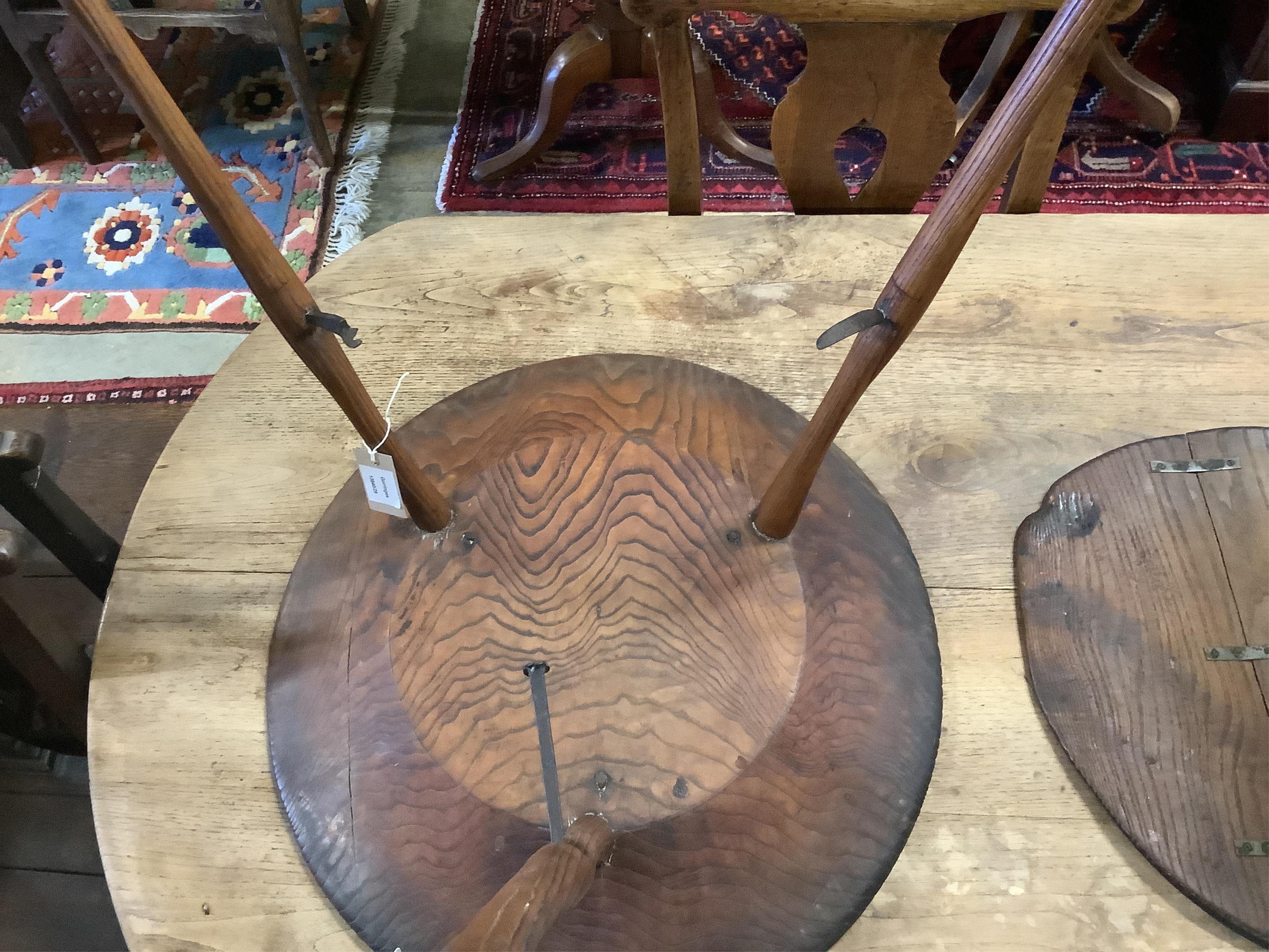 An unusual 18th century weathered elm cricket table, width 61cm, height 60cm. Condition - fair to good